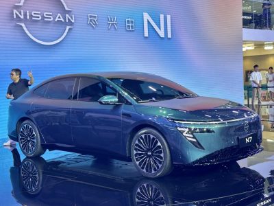 Sleek electric sedan with aerodynamic lines and distinctive LED headlights