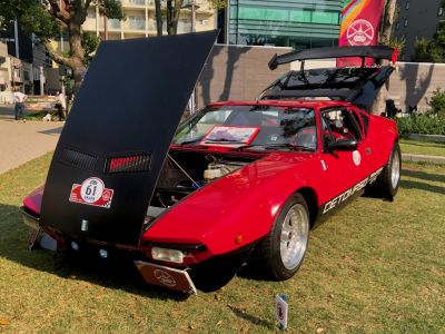 Open front hood and rear engine cover on a classic sports coupe