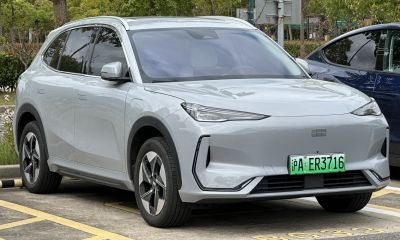 Front profile of an electric SUV with sleek LED headlights and aerodynamic styling