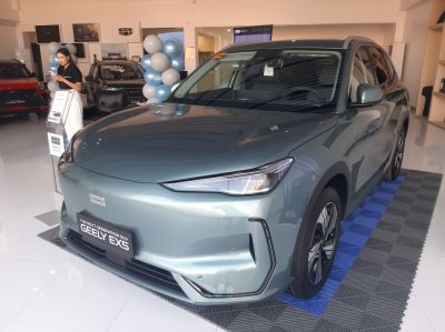 Sleek headlights and smooth body front angle with modern grille.