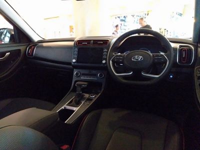 Modern dashboard and sporty steering wheel with integrated controls