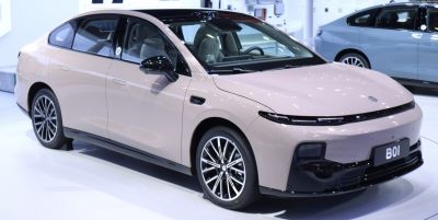Electric sedan with sleek aerodynamic body and thin LED headlights
