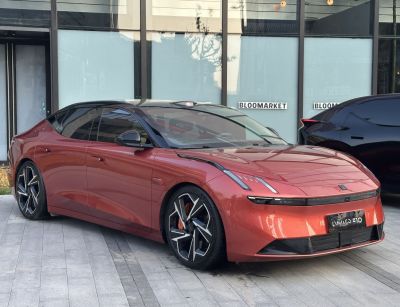 Sleek electric sedan with futuristic LED headlights and aerodynamic shape