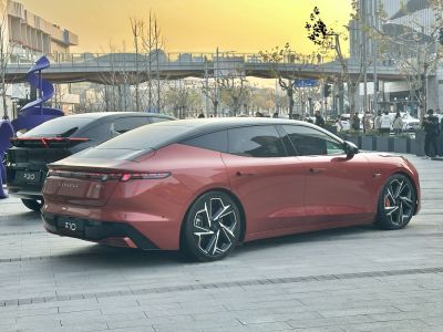 Sleek electric sedan with LED tail lights and alloy wheels
