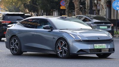 Modern electric sedan with sharp LED headlights and sporty alloy wheels