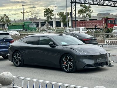 Aerodynamic electric sedan with sharp headlights and unique alloy wheels