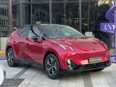 Front view of electric compact SUV with sharp LED headlights and sporty design