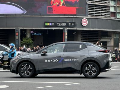 Side profile of electric SUV with sleek design and alloy wheels