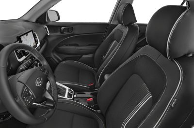 Black interior seats with white stitching and modern dashboard layout