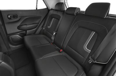Rear seat upholstery with headrests and seatbelts