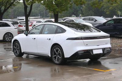 Sleek rear side view of electric sedan with LED taillights and sporty wheels