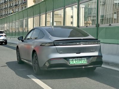 Aerodynamic rear with continuous LED taillight strip and integrated spoiler.