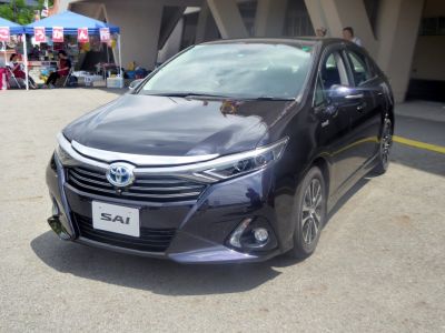Front view with chrome-accented grille and sleek headlights.