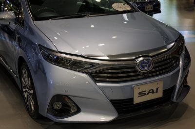Close-up of front headlight, grille, and bumper design