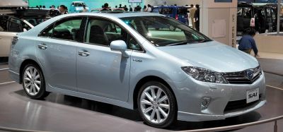 Silver sedan with hybrid badge and alloy wheels