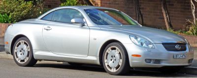 Silver coupe with sleek aerodynamic design and iconic front grille
