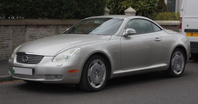 Silver coupe with sleek aerodynamic design and distinct alloy wheels