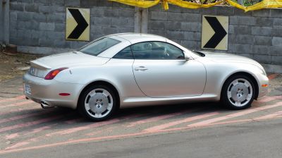 Silver luxury coupe side profile with unique wheels