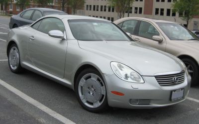Silver sports coupe with distinctive headlights and alloy wheels
