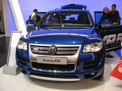 Front grille and headlights of blue midsize SUV