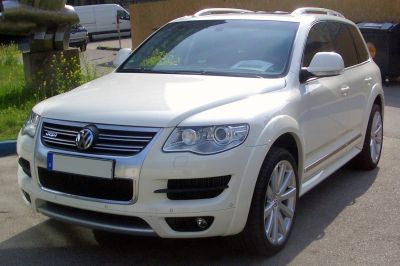 SUV front three-quarter view with distinctive headlights and grille