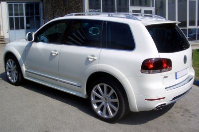 Rear side view with alloy wheels and tinted windows