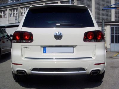 Rear view with dark taillights and dual exhaust outlets