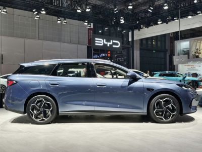 Side profile of a sleek, modern station wagon with distinctive alloy wheels.