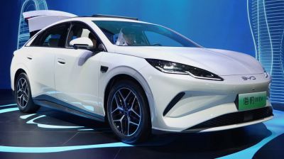 Front three-quarter angle showing sleek sedan with LED headlights.