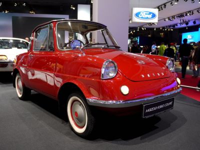 Classic vintage microcar with compact coupe design and distinctive front lights.