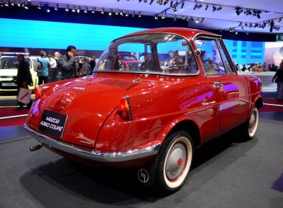 Vintage compact coupe with distinct rear window and tail light design