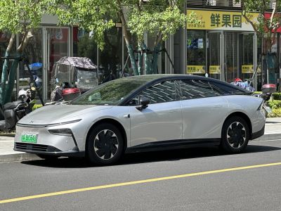 Sleek electric sedan with aerodynamic body and panoramic glass roof