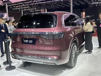 Rear view of a modern SUV with integrated full-width LED taillights and tinted rear window