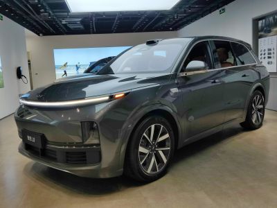 Aerodynamic headlights and modern alloy wheels on an electric SUV