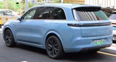Sleek SUV rear design with black alloy wheels and tinted windows.