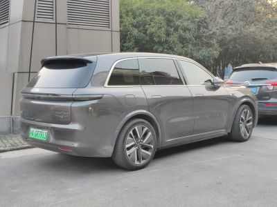 Rear side view of SUV with tinted windows and alloy wheels