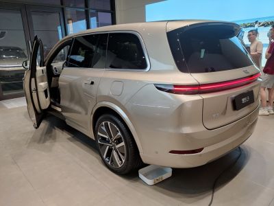 Rear and side view of SUV with rear light bar and open front door
