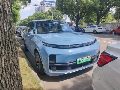 Front angle of modern electric SUV with slim LED headlights