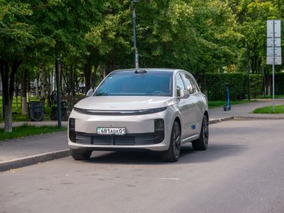 Front view of a modern electric SUV with sleek lighting and aerodynamic design