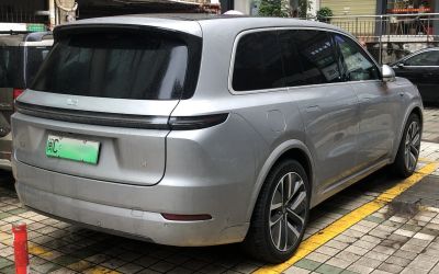 Silver SUV rear with continuous tail light and tinted windows