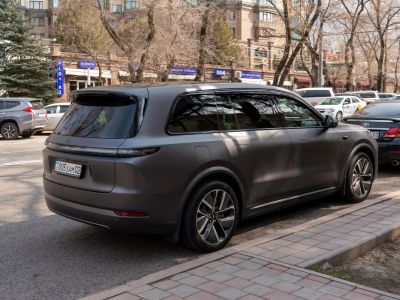 Matte finish electric SUV rear side with sleek design and tinted windows
