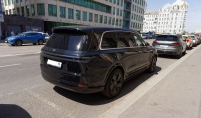 Luxury SUV rear view with tinted windows and aerodynamic shape
