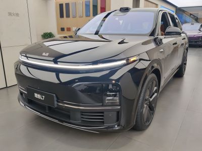 Sleek SUV front with continuous LED light bar and dark alloy wheels