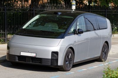 Futuristic electric MPV with sleek minimalist design and black roof