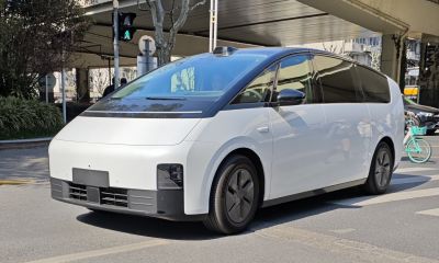 Futuristic electric minivan with sleek black and white exterior and aerodynamic shape