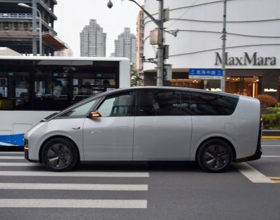 Futuristic minivan with aerodynamic shape and large tinted side windows