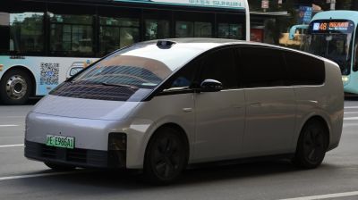 Compact electric minivan with sleek aerodynamic body and tinted windows
