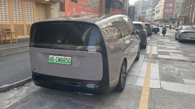 Sleek minimalist rear with large tinted back window.