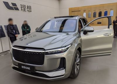 Large front grille, sharp LED headlights, open front door