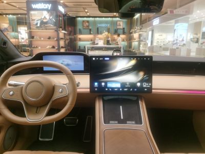 Digital dashboard and touchscreen display inside vehicle cabin